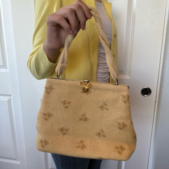 Handbags - VINTAGE 60s light cream yellow faux lumi bead handbag purse twist handle